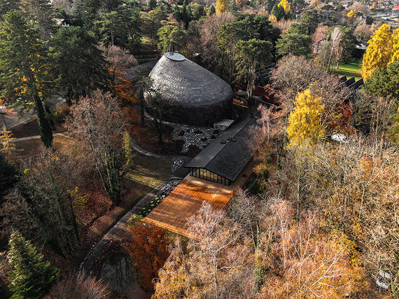 La Source Vive concert hall above Évian, wrapped in lapped copper tiles