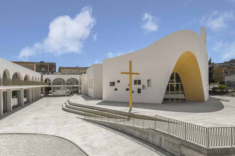The interior of the church, concrete surfaces shaped by light rather than by ornament