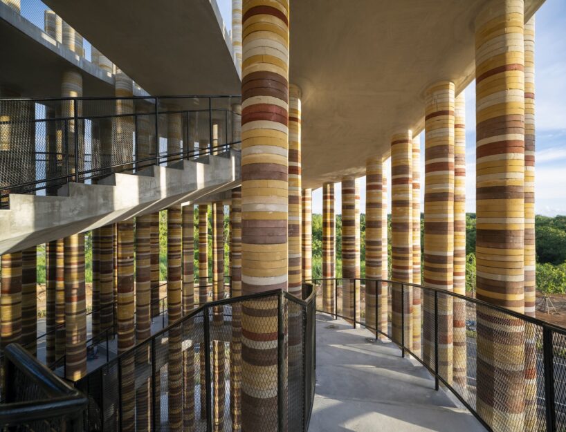Interior of Goya Tower, light falling in bars across curved walls of stacked handmade brick