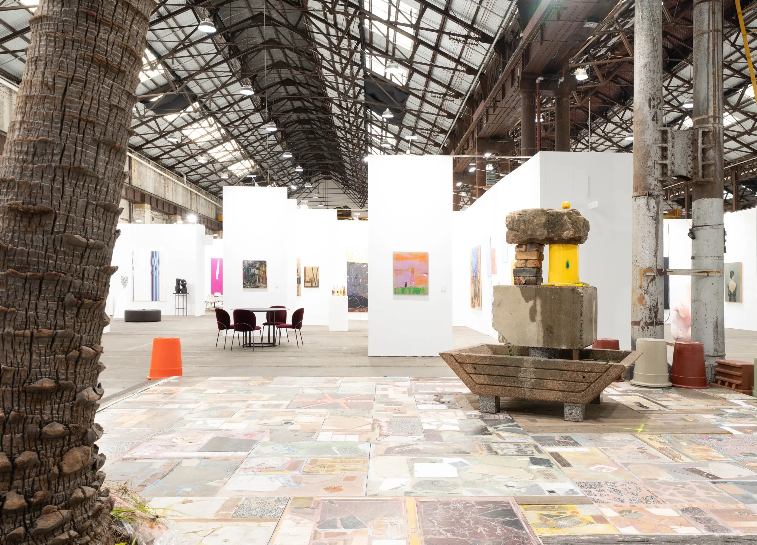 Hewson's installation at Sydney Contemporary 2026, the table standing on a floor of Piet pavers