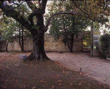 Casa das Artes, Porto, 1981-91: a granite wall, an old tree, a gate. Photography by Luis Ferreira Alves, via Dezeen