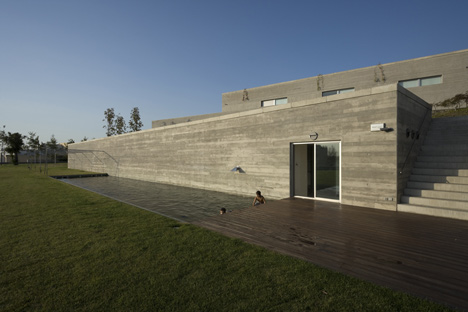 The House in Bom Jesus, Braga, 1989-94, seen from the lawn. Photography by Luis Ferreira Alves, via Dezeen