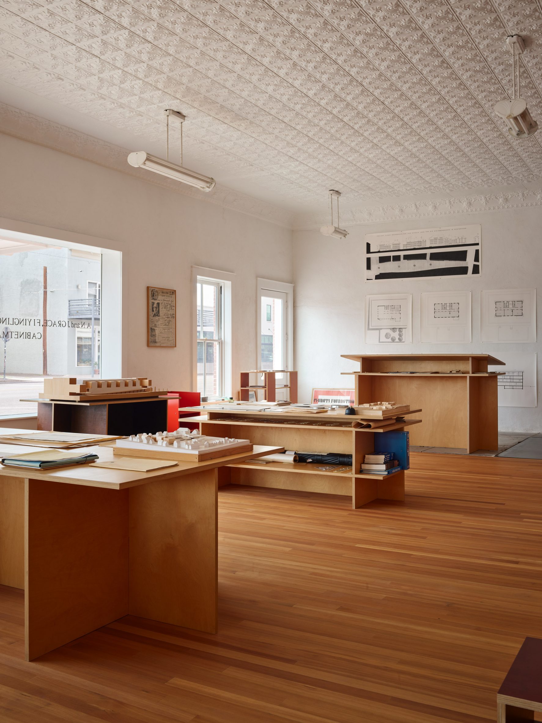 The two-storey building holds the office below and living space above
