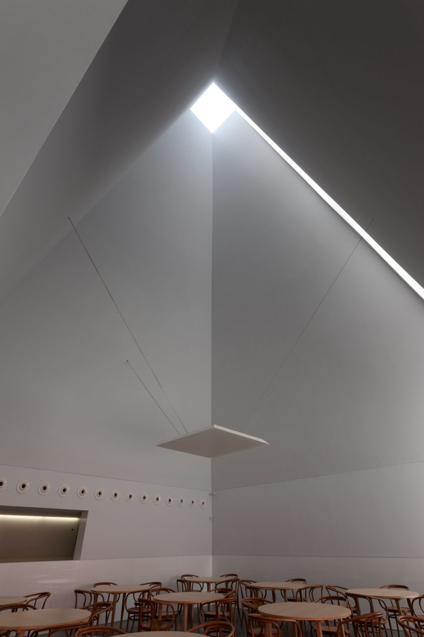 An interior corner at Casa das Histórias where the diagonal cut meets built-in seating