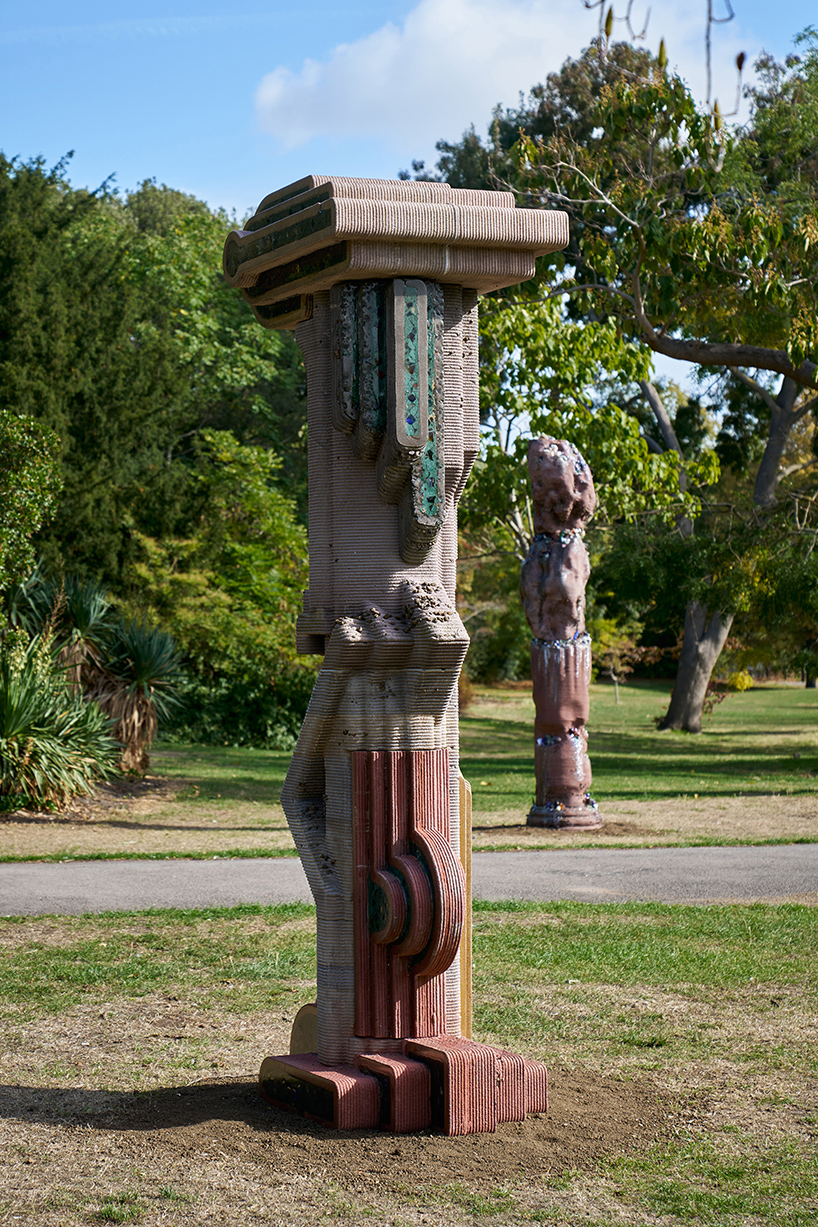 The figures standing in the park