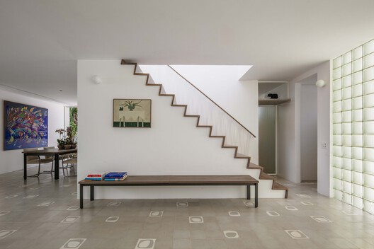 Timber stair and concrete structure inside the renovated Muxarabi House in São Paulo