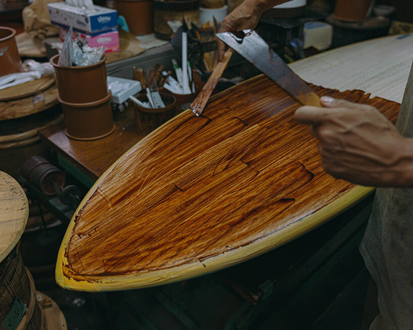 Urushi being applied over the cedar