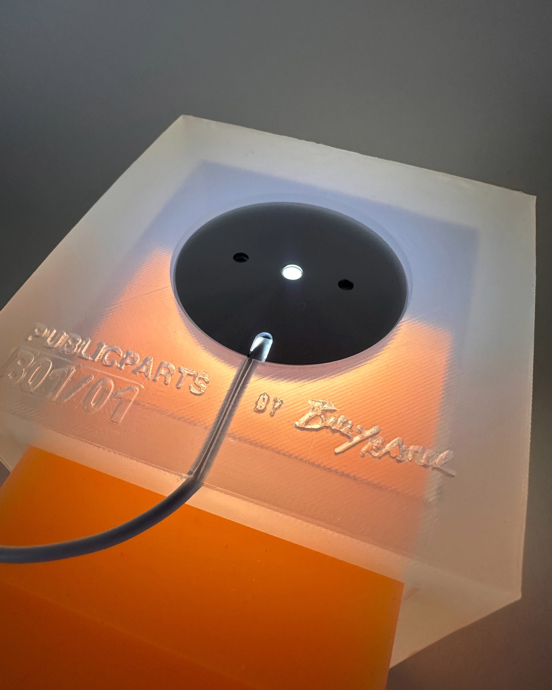 The Gel Lamp lit, with the LED held in a recessed void at the base