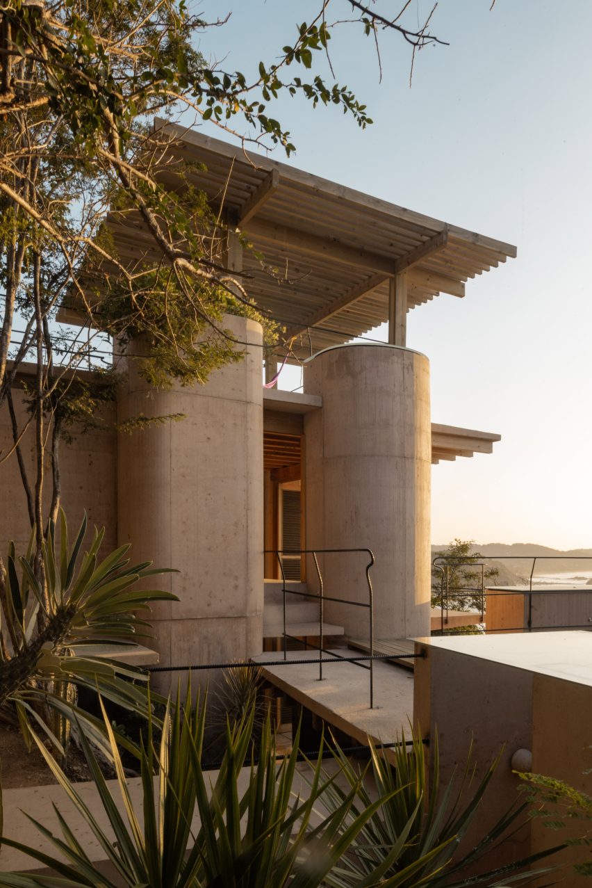 The cliffside exterior of Casa Diez Pies stepping down toward the Pacific