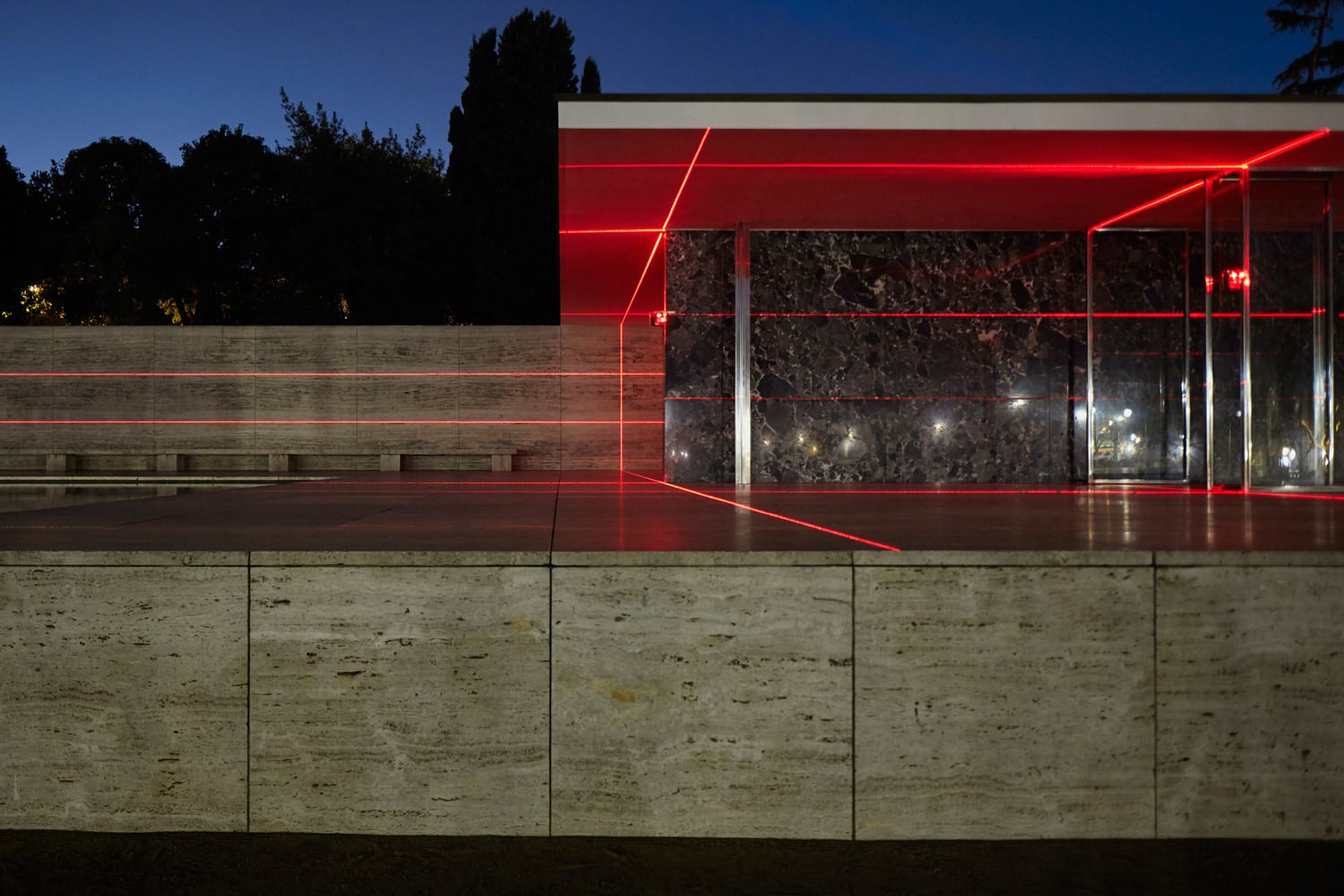 Laser lines extending past the walls and across the reflecting pool