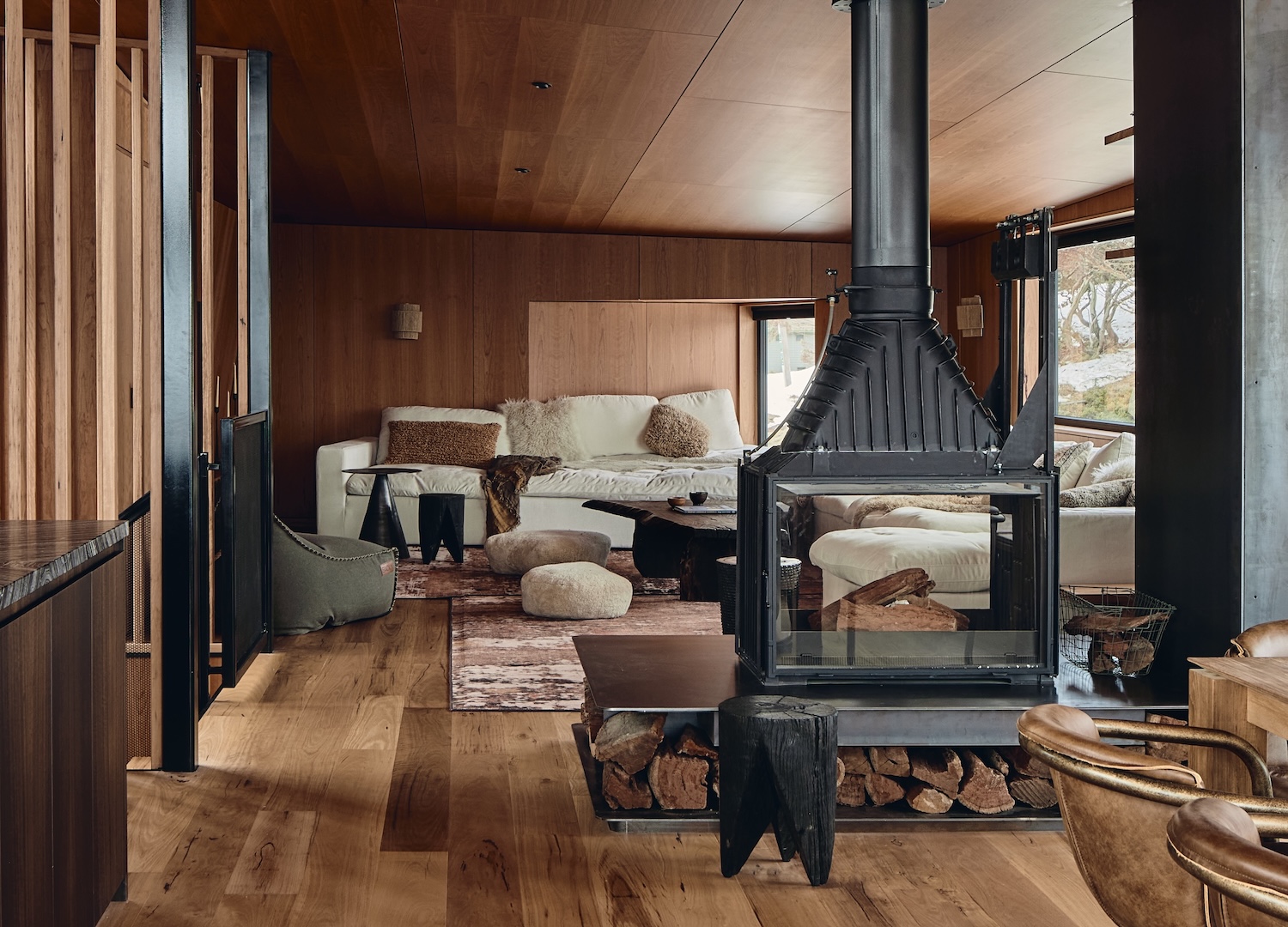 A dim interior at Alpine Lodge where the timber and stone hold the low light