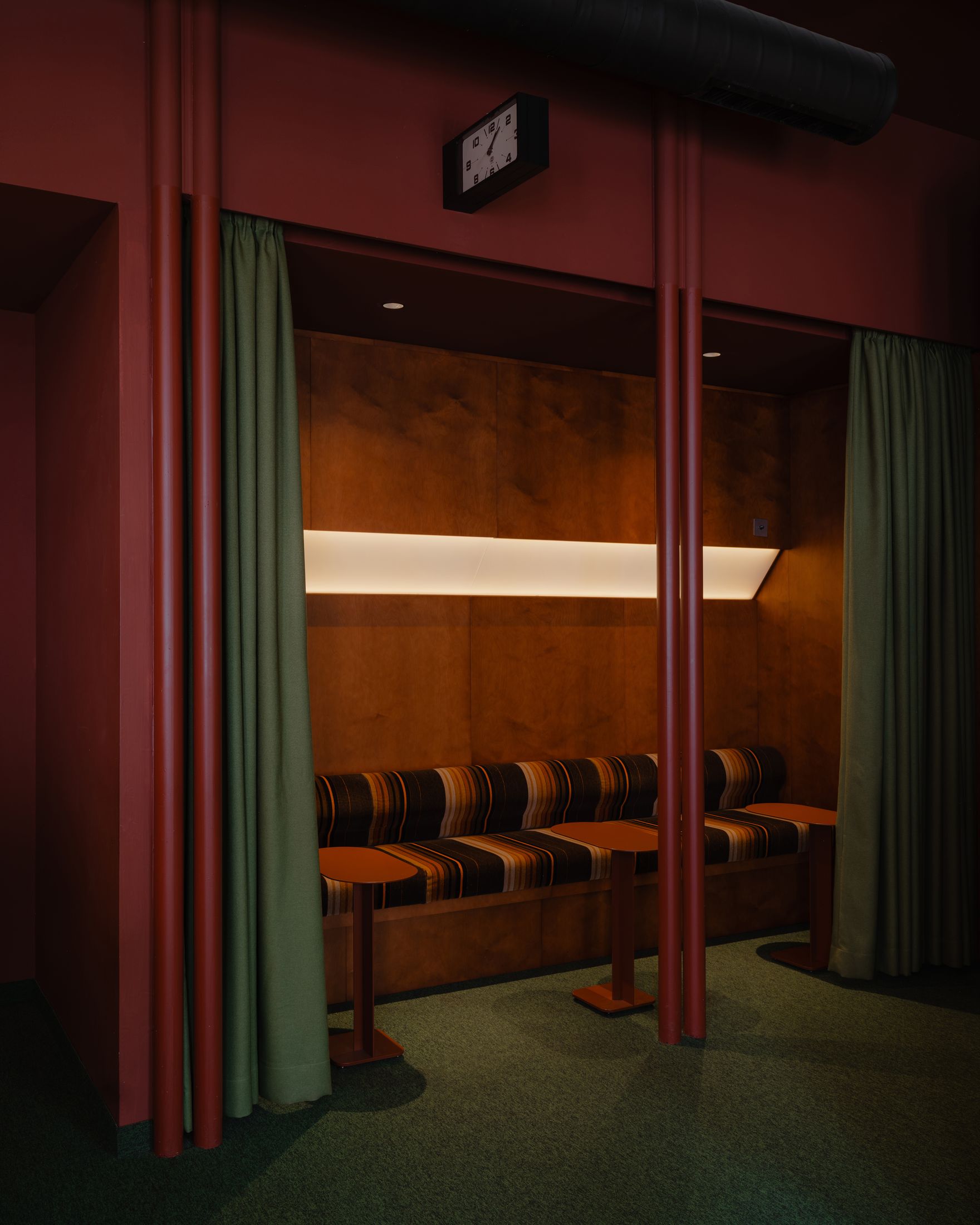 Curved forms and yellow light in the bar