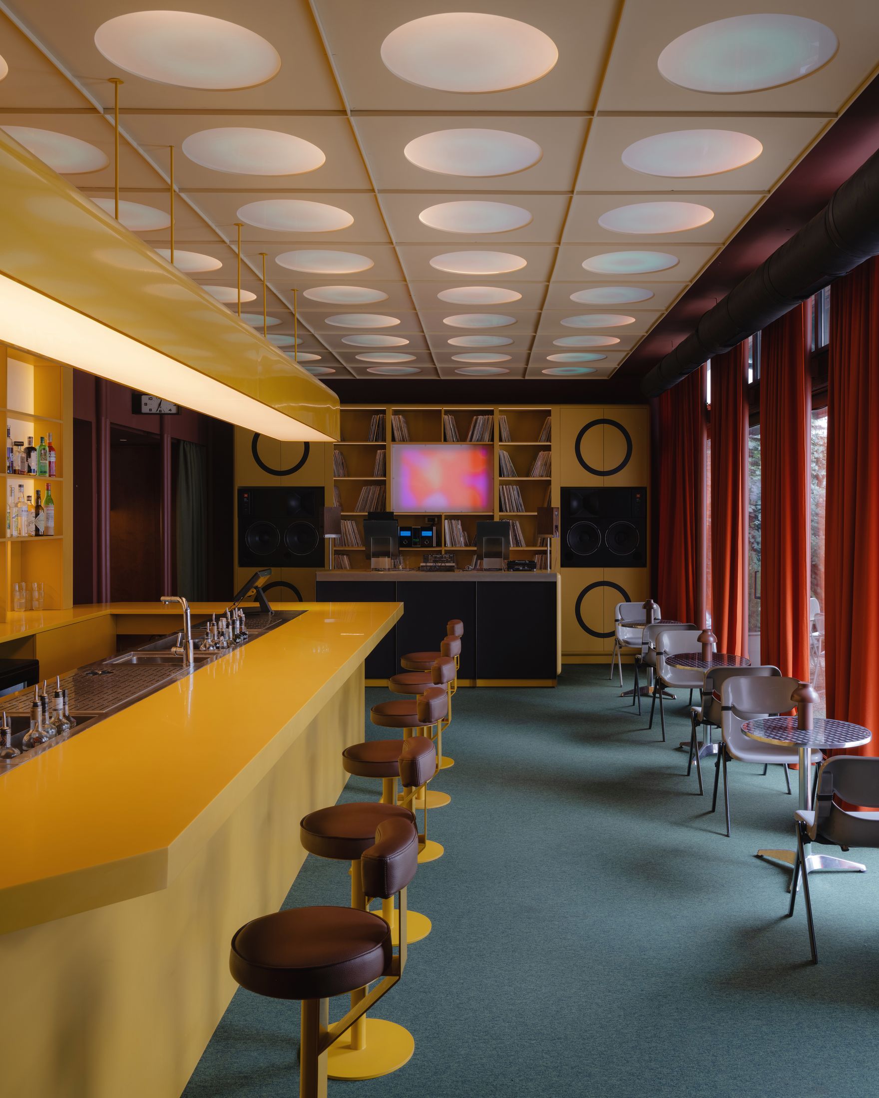 The bar, with vintage monitors and the vinyl library