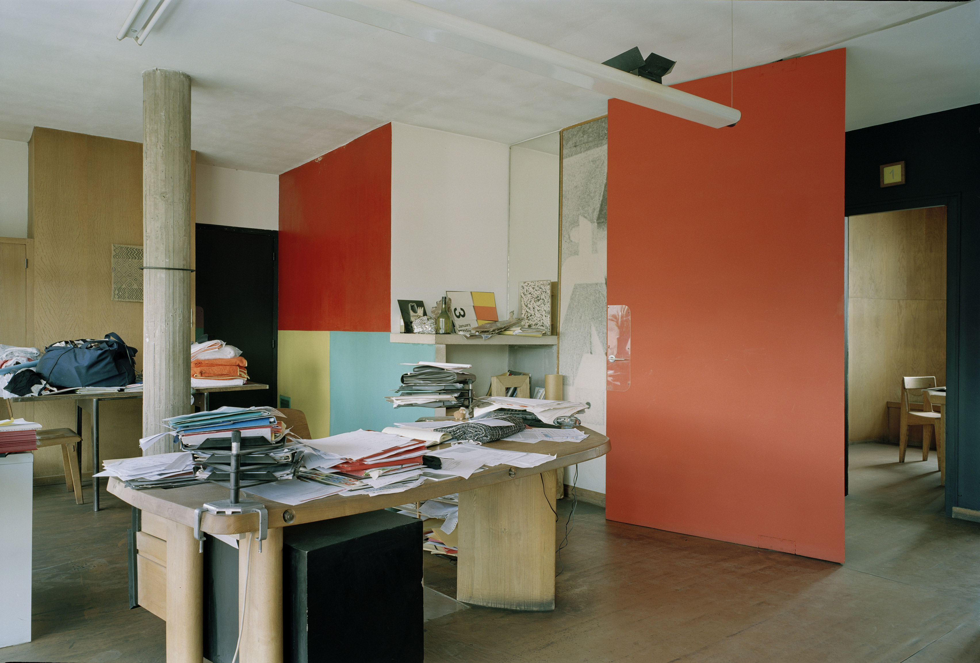 The double-height workshop floor of the Claude et Duval factory with mezzanine above