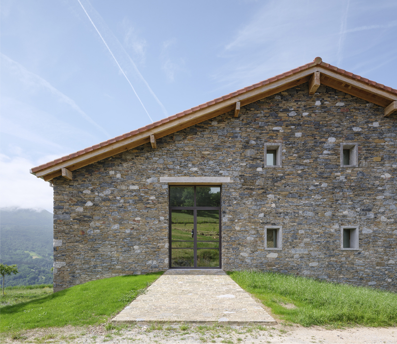 Reclaimed stone facade of the Basque farmhouse by zU-studio