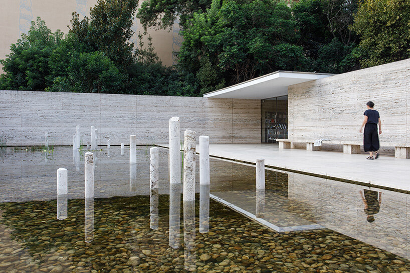 Concrete sculptures by Marit Wolters installed in the pool of the Barcelona Pavilion