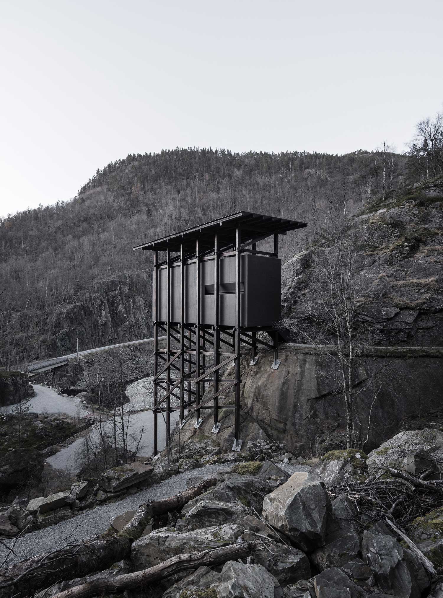 One of the mine buildings on its scaffold of posts, seen from the road. Photography via Yellowtrace