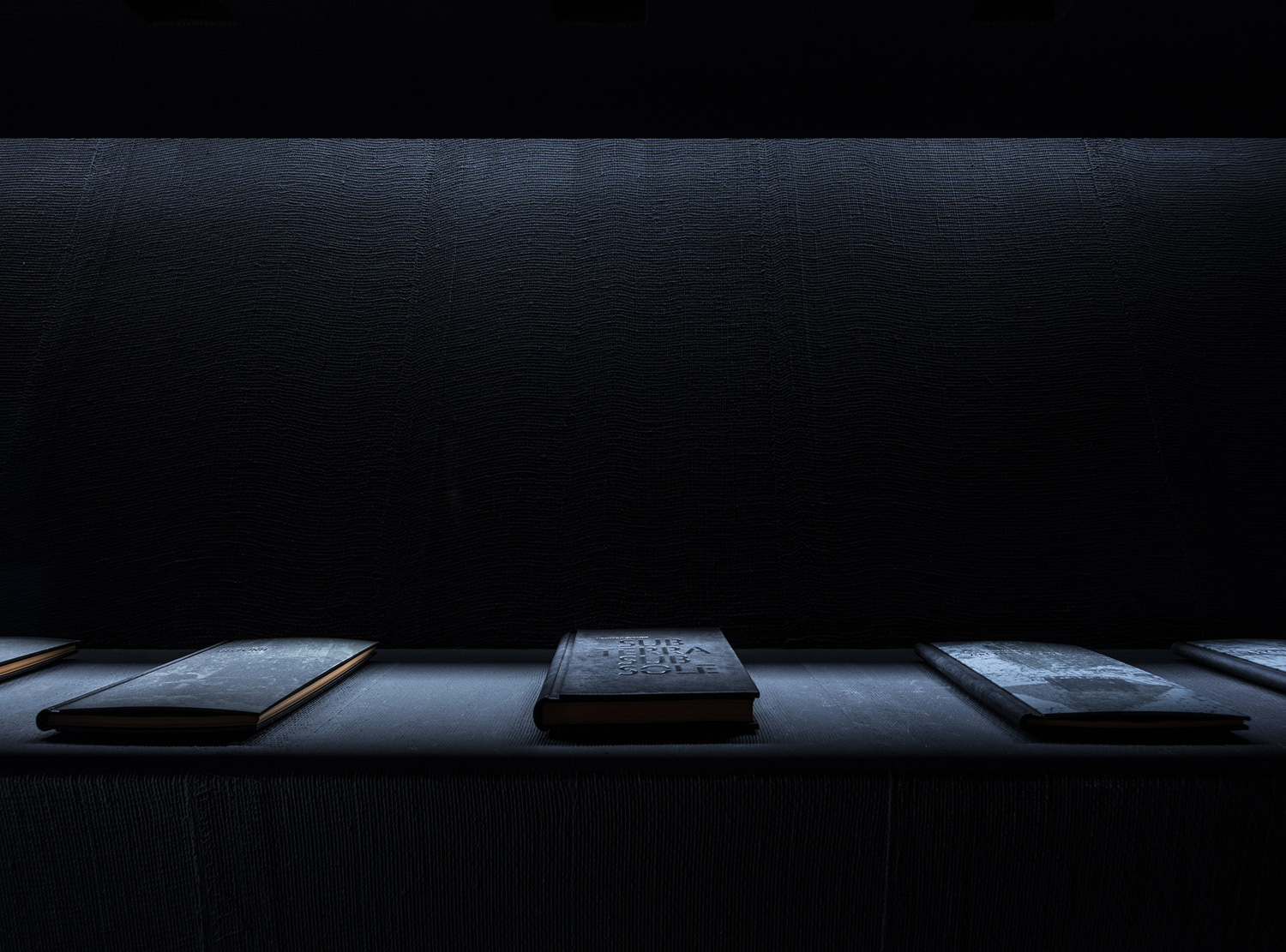 The museum room: the mine's tools laid out on a black shelf. Photography via Yellowtrace