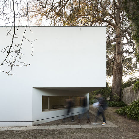 The corner of the pavilion with the low horizontal window at ground level, students passing