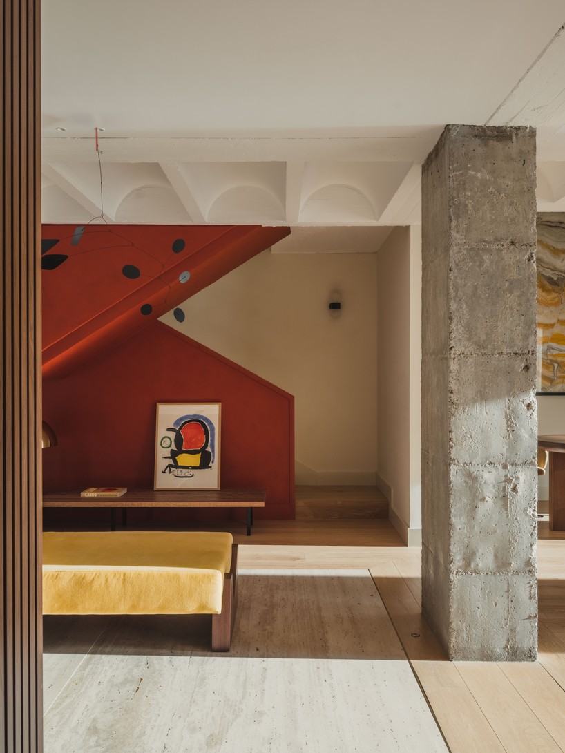 Living space with restored ceramics and new oak and travertine surfaces