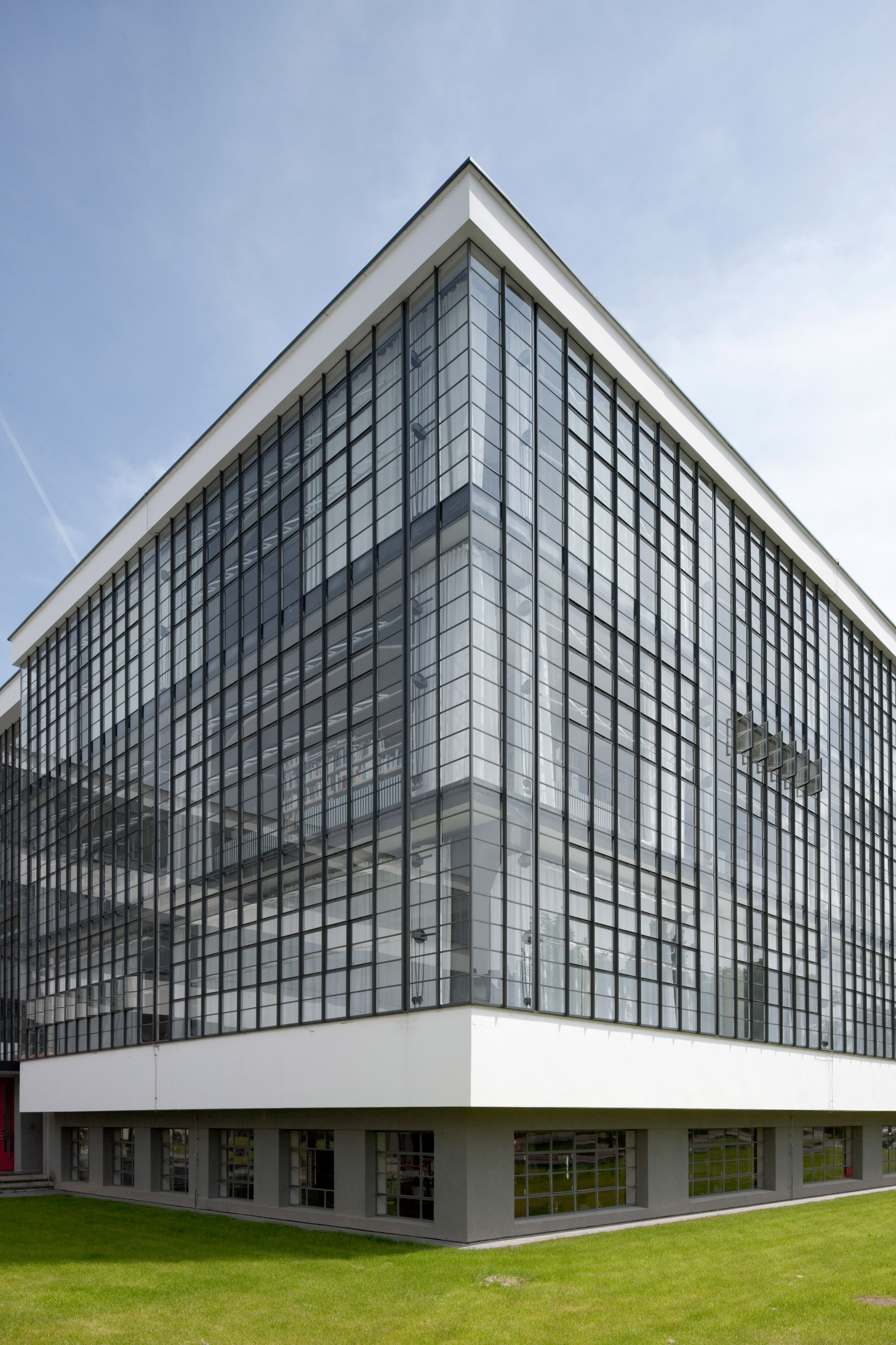 Glass curtain wall wrapping the corner of the workshop wing at the Bauhaus Dessau